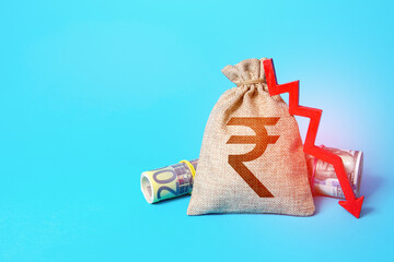 Indian rupee money bag and arrow down. Falling economy. Drop in profits. Decrease in interest rate...