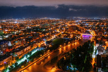 Fototapeta na wymiar Vladikavkaz, capital of North Ossetia at night. Panorama from drone flight