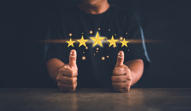 Customer experience satisfaction concept. Hand of client thumb up positive emotion smile face icon and five star. Standardization and quality in products and services. Excellent services rating.