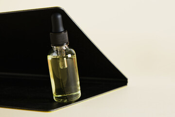 Natural herbal serum in glass bottle with a pipette Beauty spa product