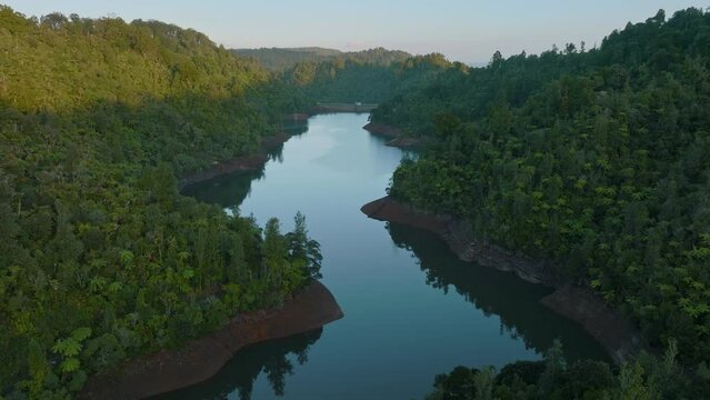 Aerial: Beautiful reservoir lake and rainforest, New Zealand