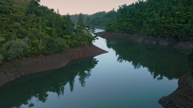 Aerial: Beautiful reservoir lake and rainforest, New Zealand