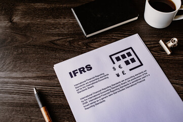 There is dummy documents that created for the photo shoot on the desk about IFRS.