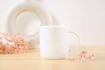 Standard white coffee mug product mockup. Boho theme craft product mockup styled with Scandinavian Boho Nordic ceramic vases against a white background.