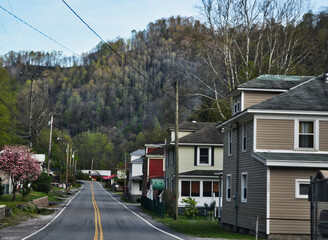 Street View of a Small Town in West Virginia along Highway with Mountain Background