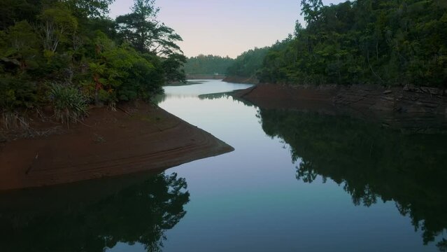 Aerial: Beautiful reservoir lake and rainforest, New Zealand