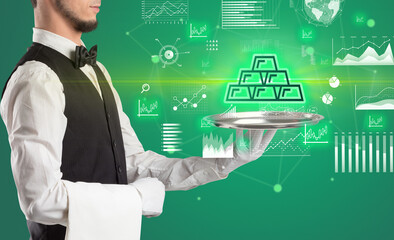 Handsome young waiter in tuxedo holding currency icons on tray