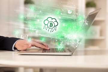 Young man watching stock market on laptop