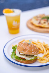 pork burger serve with french fries