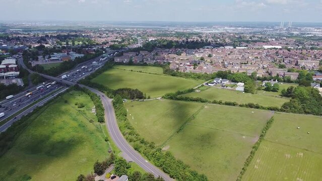 Aerial drone footage of traffic on a motorway in England. A2 - M25 Darenth Interchange in Kent, leading to Dover, London, Queen Elizabeth II bridge and Essex, UK.
