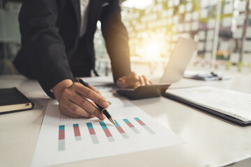 Woman investment consultant analyzing company annual financial report balance sheet statement working with documents graphs. Stock market. financial and investment concept.