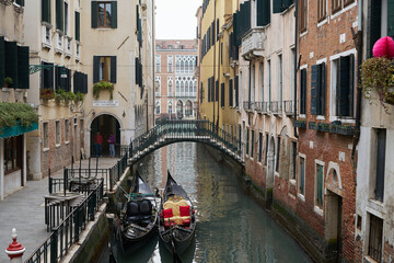 Fototapeta na wymiar Gondola in Canal in Venice. View of Venetian Canals and Bridge