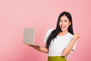 Portrait of happy Asian beautiful young woman teen confident smiling face holding using laptop...