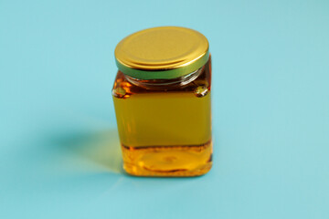 Honey in a cosmetological jar on the table
