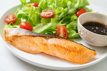 grilled salmon fillet steak with salad