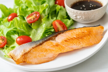 grilled salmon fillet steak with salad