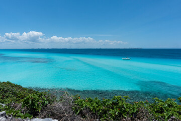 Aerial view of a luxury yacht anchored in a blue lagoon, Isla Mujeres, Mexico