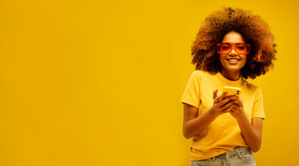 Portrait of inspired dreamy afro american girl use her smartphone think decide what comment look copyspace