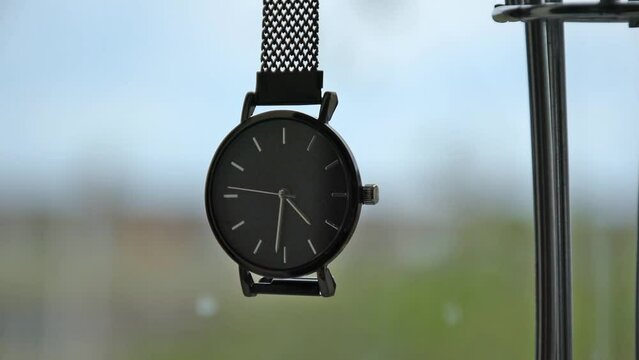 Elegant wrist watch. Close-up on a blurred background.