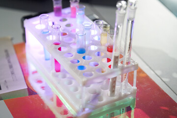 A set of laboratory utensils for medical or scientific research. A beaker with chemicals. Laboratory glass equipment, test tubes and flasks. High quality photo