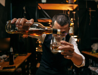 Barman pouring whiskey whiskey glass beautiful night