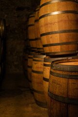 Wooden barrels in wine cellar