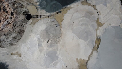 An aerial view of the piles of fine stone in the quarry. Fine stone is used in the production of quality asphalt for roads and for the preparation of concrete used in construction