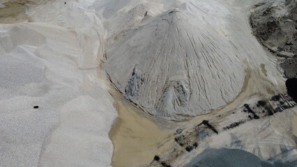 An aerial view of the piles of fine stone in the quarry. Fine stone is used in the production of quality asphalt for roads and for the preparation of concrete used in construction