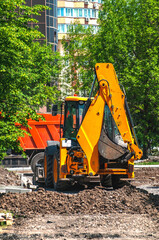 Orange construction car on road construction
