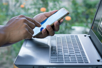 cyber security in two-step verification. two-factor authorization. man hands holding mobile phone...