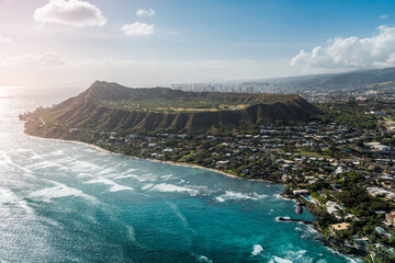 Aerial view of Diamond Head Mountain , volcanic tuff cone and city buildings in background, Honolulu, Oahu Island. Light effect applied - obrazy, fototapety, plakaty
