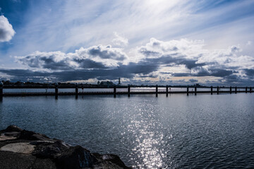 Fototapeta premium The cloudy evening at the pier