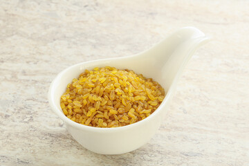 Raw bulgur in the bowl