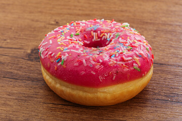 Sweet glazed struwberry donut with icing