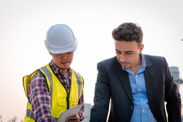 Businessman and engineer meeting and discuss project in working site, Teamwork project concept.