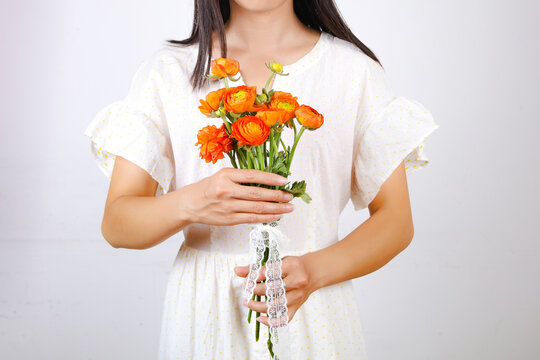 The Young Woman Wearing White Skirt Holding A Bouquet No Face