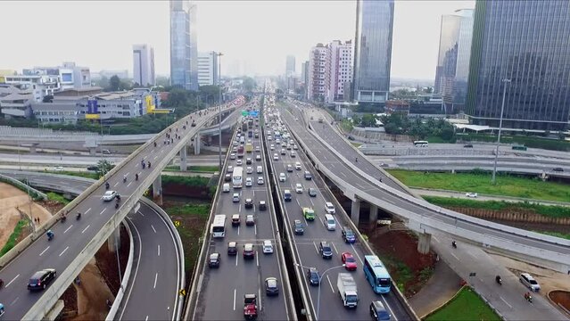 Busy traffic with chaotic vehicles scrambling on the highway