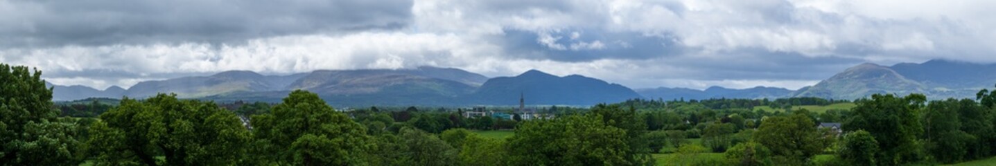 wide scenic panorama of the Magnetron Mountain Group in Killarney National Park with the mountain tops in the clouds