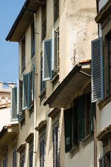 Fototapeta na wymiar Facades with wooden window shutters in Florence, Italy