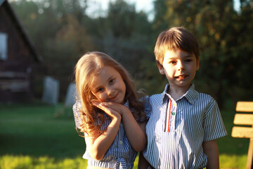 Children on a walk in the summer. Children indulge in the country. Laughter and splashing water.