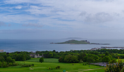 Ireland's Eye island as seen from Howth with Howth Castle in the mid ground