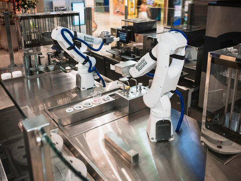 Robotic Barista making coffee automated Robot display for coffee server Cafe business : Bangkok, Thailand - May 5, 2022