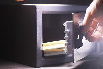 Open safe in a wealthy house. Safety box in hotel room. Concept safe storage of money and documents
