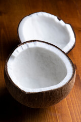 Fototapeta na wymiar 硬いオールドココナッツの実を割って中身の固形胚乳を取り出す