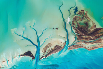 Aerial view of the Bahamas islands, Turquoise ocean surface, Tidal Flats and Channels, Long Island, the Bahamas, Sandy Cay. Top view of Caribbean sea texture. Elements of this image furnished by NASA. - obrazy, fototapety, plakaty