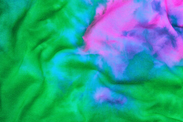 Abstract tie dye neon multicolor folded fabric cloth boho pattern texture for background, sale...