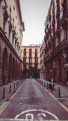 Fototapeta na wymiar Vintage Retro Style Alley in Barcelona, Spain, Old Empty Narrow Street with motorcycle in Catalonia, Vintage street photo, Selective focus