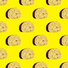 Top view of the pattern of a piece of cut bread on a yellow background. Morning food