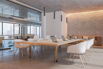 Fototapeta na wymiar Perspective view on light wooden conference table with modern laptops surrounded by white chairs in sunlit meeting room with brick wall, cozy sofa and glass door. 3D rendering