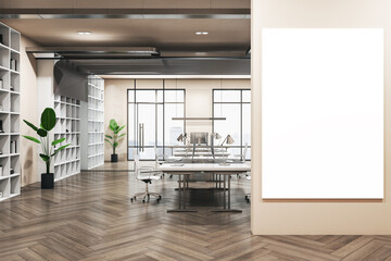 Big blank white poster with place for your logo on light wall in modern interior design office with wooden floor, cozy workspaces with computers and green plants in flowerpot. 3D rendering, mock up
